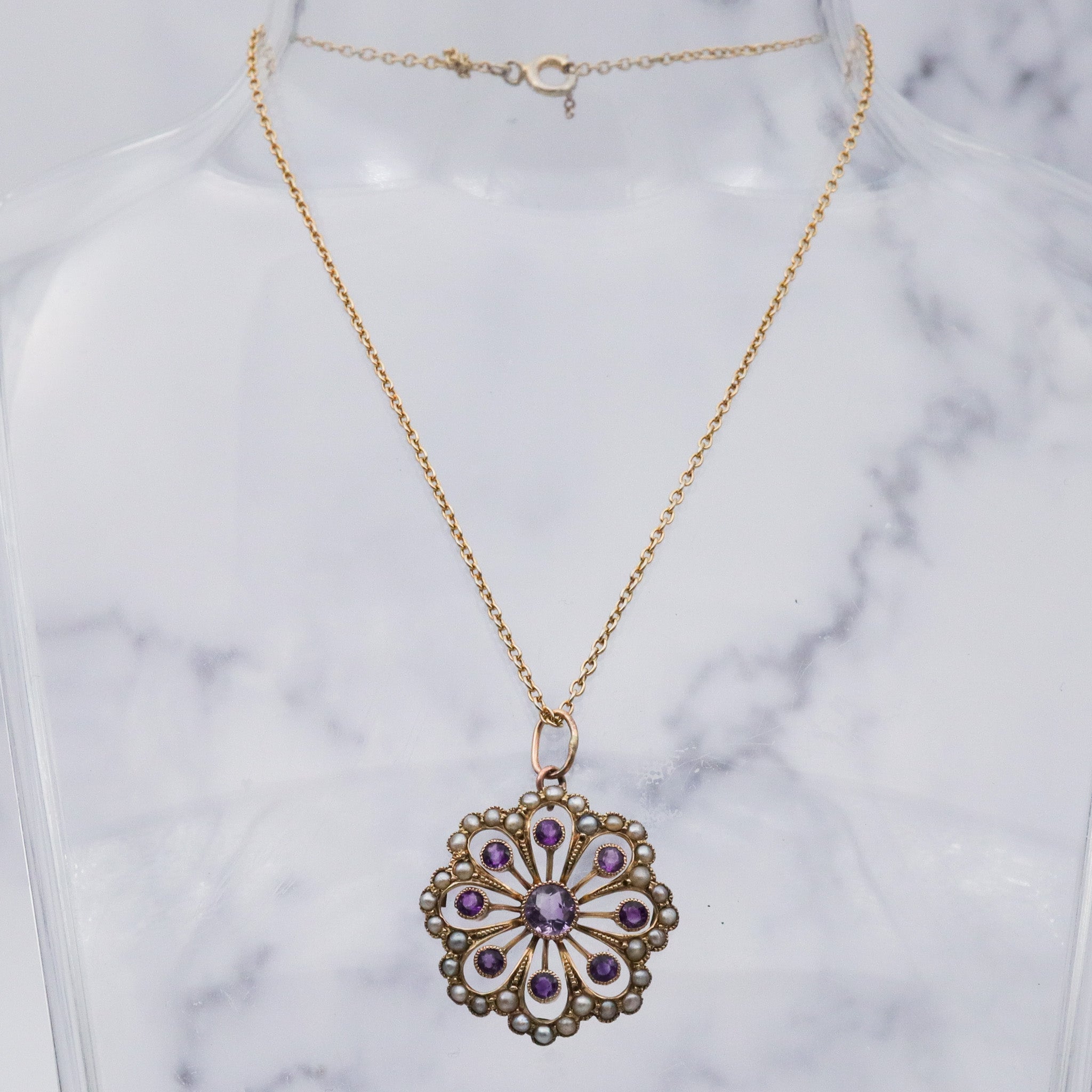 Antique early Victorian 9k gold, amethyst and split pearl flower pendant